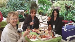 “We girls never give up” ladies who brought a champagne picnic and were determined that it would go ahead even though it was raining.