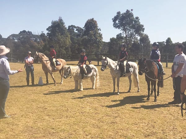 Some of our beginner riders all ears for their show riding rally day session.
