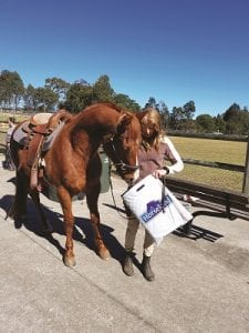 Dean inspecting his Fun Day prize with Pam Pike